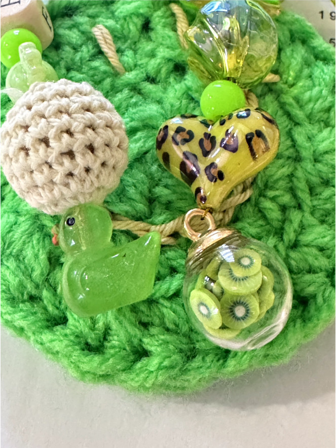 BIJOU DE SAC HYPNOCHIC SMILEY VERT